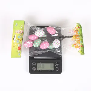 Detailed view of Easter artificial egg branch decoration weighing 18.6g on a scale