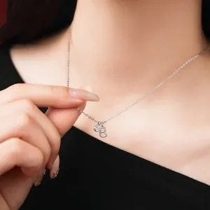 Close-up detail of a S925 sterling silver necklace with a letter B pendant charm.
