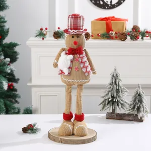 Detailed macro view of a handmade Christmas gingerbread snowman doll on a wooden base