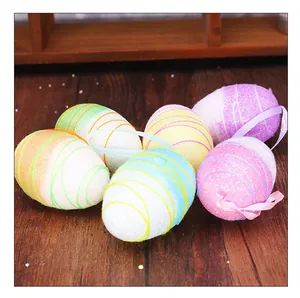 Macro view of six colorful glittery Easter foam eggs on a rustic wooden tabletop