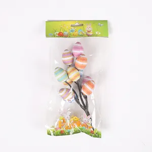 Detailed view of colorful striped Easter egg branches in retail packaging