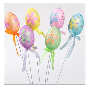 Bastoncini di uova di Pasqua glitterati con fiori e nastri per decorazioni fai-da-te