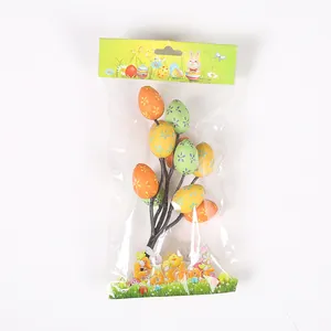 Detail view of artificial floral patterned Easter egg picks in holiday packaging