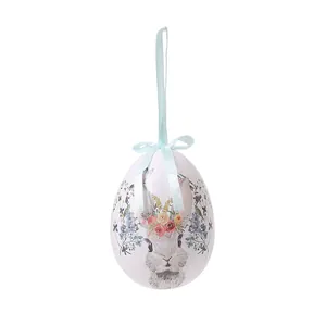 Huevo de Pascua decorativo 8x10cm con diseño de conejo floral y lazo azul colgante.