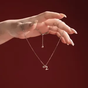 Close-up of S925 sterling silver necklace with a number 2 pendant and crystal