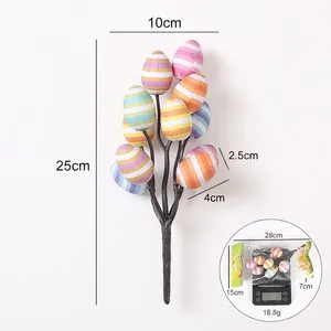 Decorative Easter egg branches with colorful striped patterns for festive tabletop display