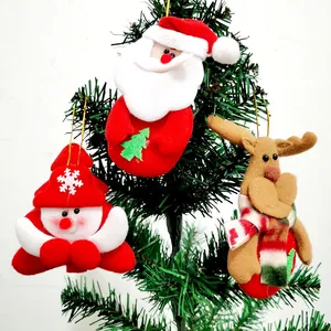 Close-up of plush Santa Claus, Snowman, and Reindeer Christmas tree hanging ornaments.