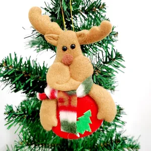 Close-up of a cute felt reindeer Christmas tree ornament with a red and green scarf