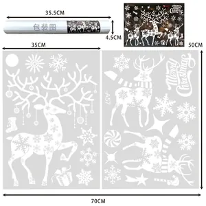 Detailed view of white Christmas reindeer and snowflake window stickers showing product dimensions