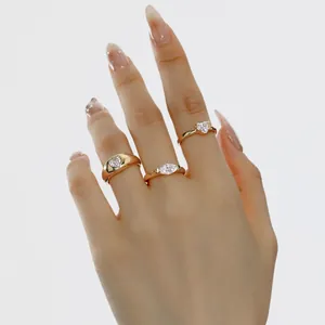 Elegantly styled gold S925 rings with heart and marquise stones shown on hand