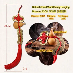 Detail of natural gourd and brass Five Emperor Coins with red Chinese knot tassel.