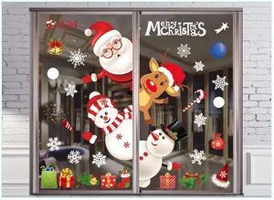 Colorful Christmas window decals with Santa, reindeer, and snowman on glass door.