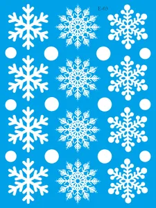 Detailed view showing various white snowflake static cling Christmas window sticker patterns
