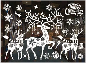 White Christmas window stickers with reindeer, snowflakes and Merry Christmas text.