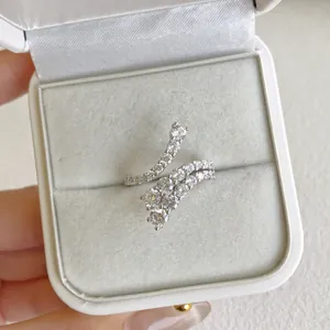 Close-up of elegant S925 silver wrap ring with brilliant cubic zirconia stones in white box