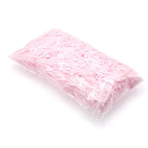 Close-up detail showing a bulk pack of decorative pink shredded paper gift filler.
