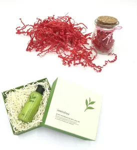 Decorative red and white crinkled shredded paper filler for gift boxes and packaging
