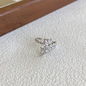 Close-up detail of S925 sterling silver ring featuring sparkling marquise and round cubic zirconia.