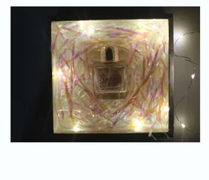 Iridescent shredded paper filler inside a gift box with magical colorful glow effect