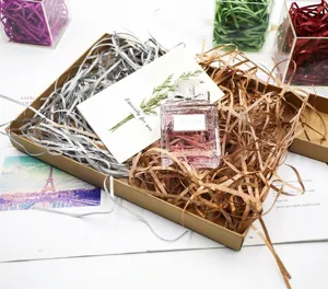 Sparkling silver and bronze metallic shredded paper filler in a gift box for presents