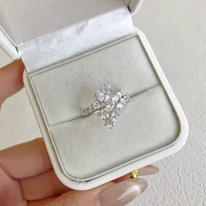 Close-up of elegant S925 silver ring with pear-shaped zircon inside a white gift box