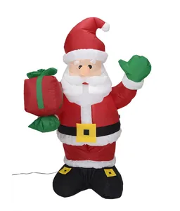Detailed view of a large inflatable Santa Claus waving with a red and green gift bag