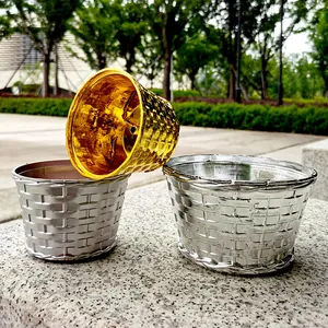 Detailed view of metallic gold and silver woven texture Christmas tree base pots