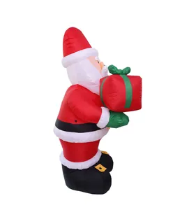 Side profile of an inflatable Santa Claus holding a red gift box for Christmas decor