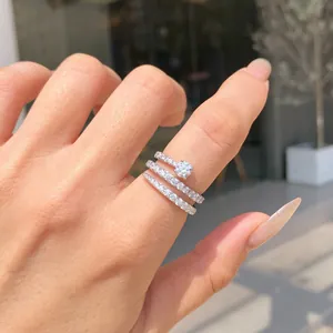 Close-up of S925 sterling silver triple-band ring set with sparkling cubic zirconia stones.