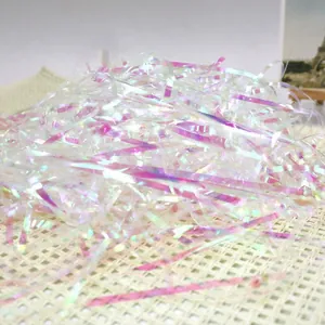 Iridescent holographic shredded paper filler for gift boxes and packaging decor.