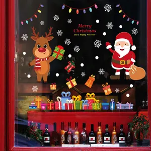Autocollants de Noël pour fenêtre avec le Père Noël et un renne sur une vitrine