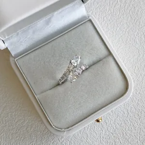 Macro detail of elegant S925 silver ring with sparkling zirconia in a white gift box.