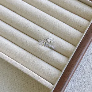Detailed view of S925 sterling silver bypass ring set with sparkling zircons in a jewelry tray