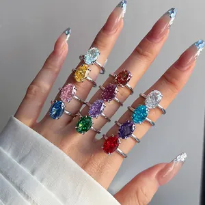 Detailed view of silver rings featuring oval-cut gemstones in various vibrant colors