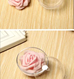 Detail view of a clear plastic hollow ball containing a pink decorative foam rose