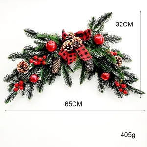 Detailed view of a 65cm Christmas ox-horn wreath with pine cones and red berries