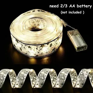 Warm LED Christmas ribbon light string with gold star patterns for tree decoration