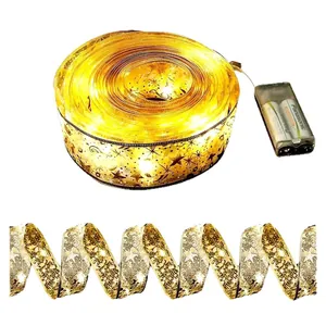 Christmas LED ribbon fairy lights with gold star patterns and battery box