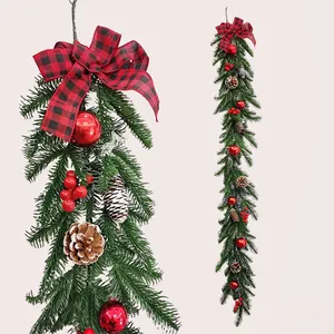 Christmas teardrop swag featuring pine branches, red plaid bow, and festive ornaments