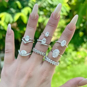 Close-up of elegant S925 silver rings with oval-cut ice-flower cubic zirconia on fingers