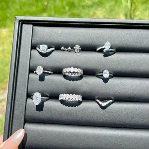 Detail view of 925 sterling silver rings with oval cubic zirconia in a black display tray.