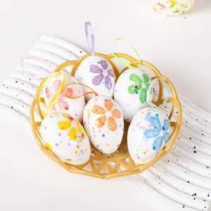 Close-up of glittery foam Easter eggs with colorful floral patterns and hanging loops