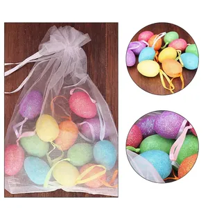 Colorful glittery foam Easter eggs in a white mesh bag for festival decoration