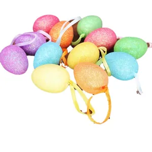 Set of colorful glitter foam Easter eggs with hanging ribbons for spring decor