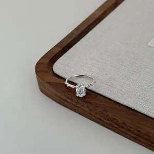 Detail view of an elegant S925 sterling silver ring with a sparkling oval zircon centerpiece.
