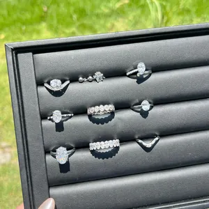 Elegant S925 sterling silver rings set with oval ice flower cut zircons in a jewelry tray