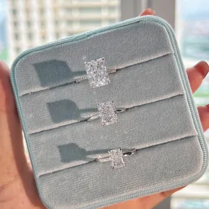 Macro detail of three luxury sterling silver rings with ice-cut zircon stones in a blue box.