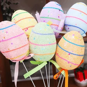 Colorful foam Easter egg picks with glitter and ribbons for holiday decoration