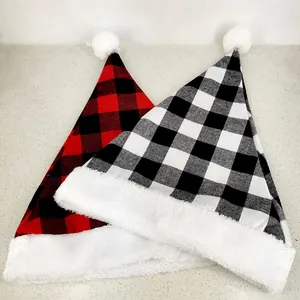 Detailed view of red and black buffalo plaid Christmas hats with white plush trim