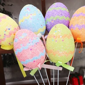 Colorful glitter foam Easter egg picks with ribbons for festive holiday floral arrangements